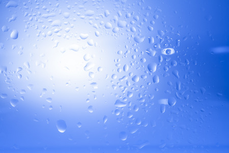 water drops on blue backgroundの写真素材