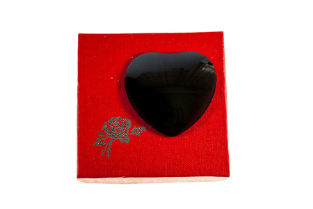 Black heart in red gift boxes on Valentine's Day.の写真素材