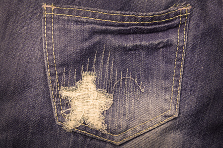Blue torn denim jeans textureの写真素材