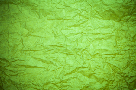 Green paper crumpled background.の写真素材