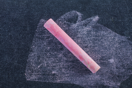 Blackboard and pink chalkの写真素材