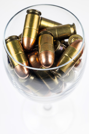 Ammunition in a wine glass.の写真素材