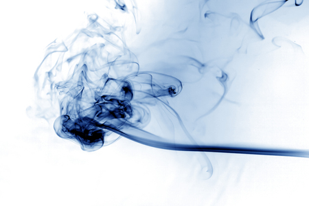 Blue smoke on white background.の写真素材