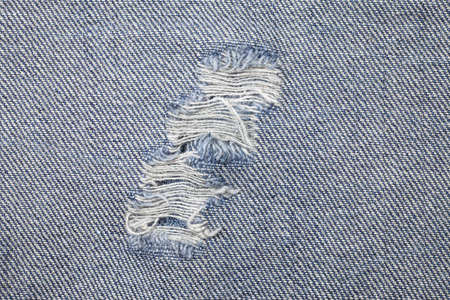 Blue torn denim jeans textureの写真素材
