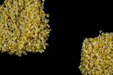 peeled split soy beans on black backgroundの写真素材