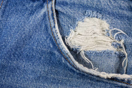 Blue torn denim jeans texture.の写真素材