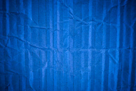 Crumpled blue cardboard texture.の写真素材