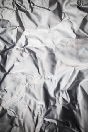 Crumpled aluminum foil background.の写真素材