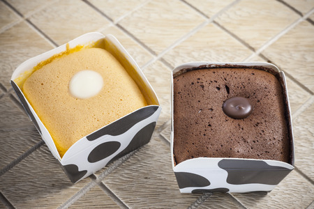Chocolate ,Orange Cake on Cow Cup.