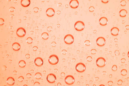 Water bubble on red glass.の写真素材