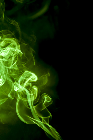Green smoke on black background.の写真素材
