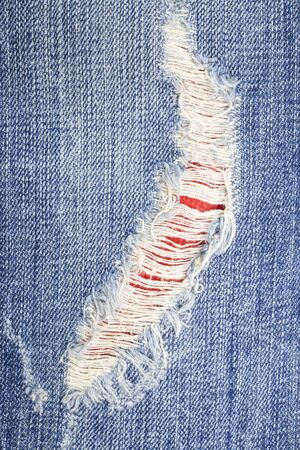 Torn denim jeans texture.の写真素材