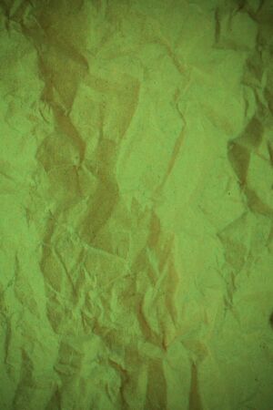 Green crumpled paper background.の写真素材