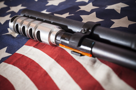 Shotgun American flag background.の写真素材