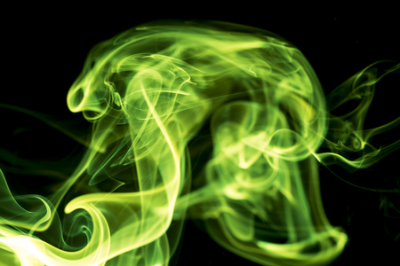 Green smoke on black background.の写真素材