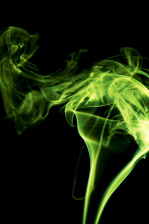 Green smoke on black background.の写真素材