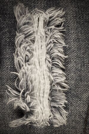 Torn denim vintage texture background.
