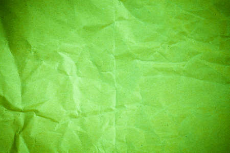 Vignette green crumpled paper.の写真素材