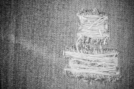 Jeans torn texture background.