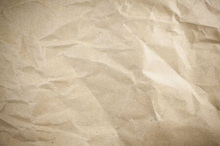 Vignette brown crumpled paper.の写真素材