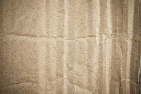 Cardboard brown paper background vignette.の写真素材