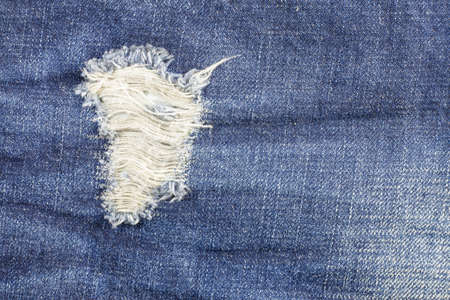 Jeans torn denim texture.