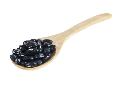 Black Eyed Peas in wooden spoon on white background.の写真素材