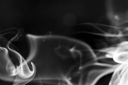 White  smoke motion on black background.の写真素材