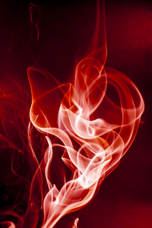 Red smoke motion on black background.の写真素材