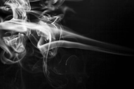 White  smoke motion on black background.の写真素材