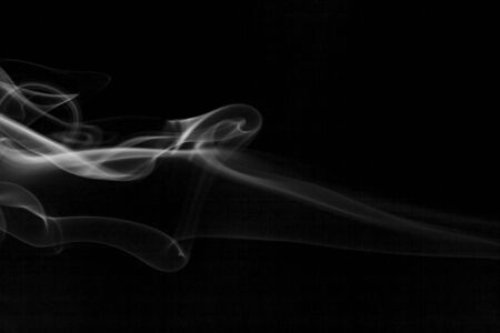 White  smoke motion on black background.の写真素材