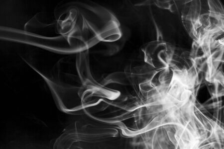 White  smoke motion on black background.の写真素材