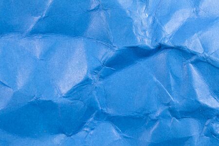Crumpled blue paper background.の写真素材