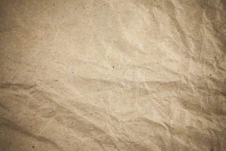 Textured crumpled packaging brown paper background.の写真素材
