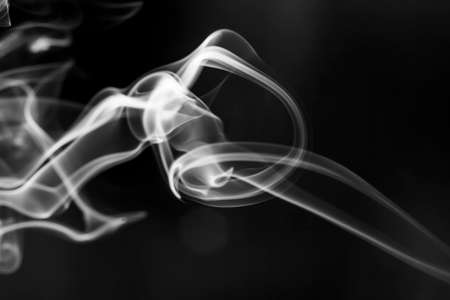 White  smoke motion on black background.