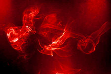 Red smoke motion on black background.