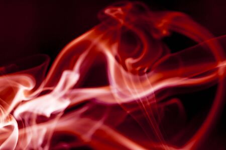 Red smoke motion on black background.