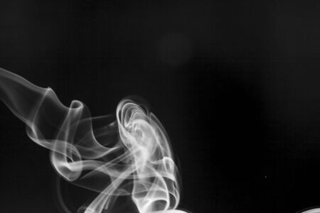 White  smoke motion on black background.の写真素材