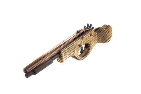 Catapult Gun toy wooden shooting rubber on white background.の写真素材