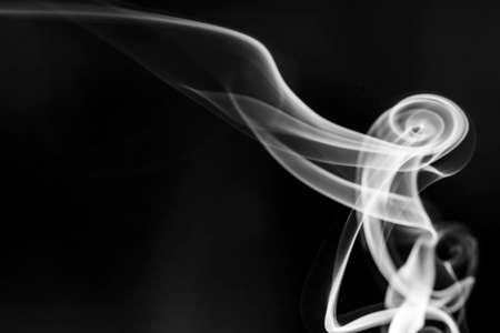 White  smoke motion on black background.の写真素材