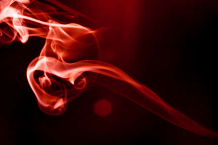Red smoke motion on black background.の写真素材