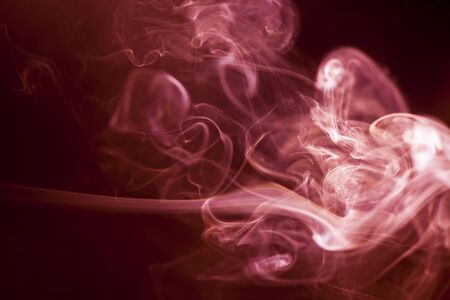 Red smoke motion on black background.の写真素材