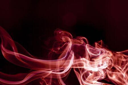 Red smoke motion on black background.の写真素材