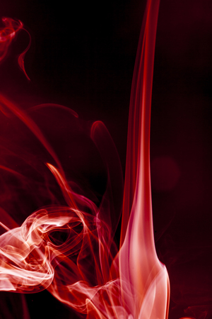 Red smoke motion on black background.の写真素材