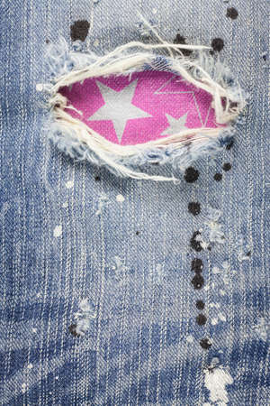 Torn denim jeans texture.の写真素材