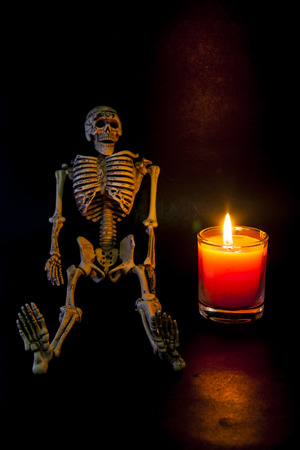 Human skeleton on candlelight Halloween night.の写真素材