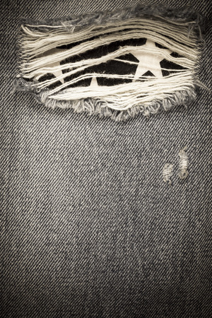 Vintage torn denim jeans texture.の写真素材