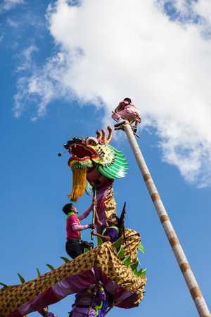Udon Thani, Thailand on -1 December 2015, Udon Festival,The annual event parade on the streets, Chinese dragon during Udon Thani Shrine Annual Golden Dragon,Lion Parade, Udon Thani Shrine Year celebrations 2015のeditorial素材