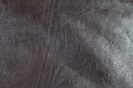 Dark brown real leather surface.の写真素材