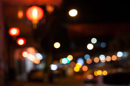 Colorful background blurred bokeh texture and defocused sparkling lights.の写真素材